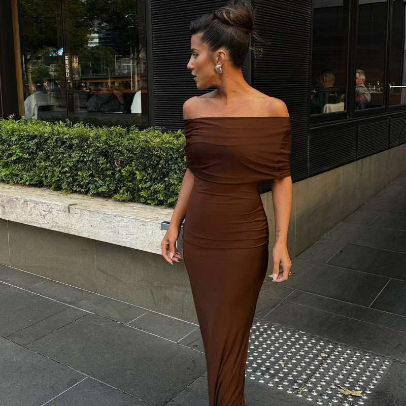 Form-fitting, long off-the-shoulder dress with an open back.