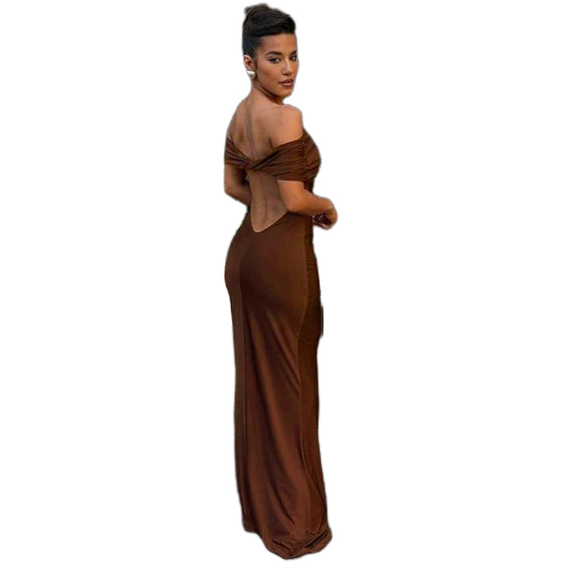 Form-fitting, long off-the-shoulder dress with an open back.