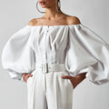 Spring and summer new design sense long sleeved bubble lantern sleeves with shoulder leakage European and American women's shirt top