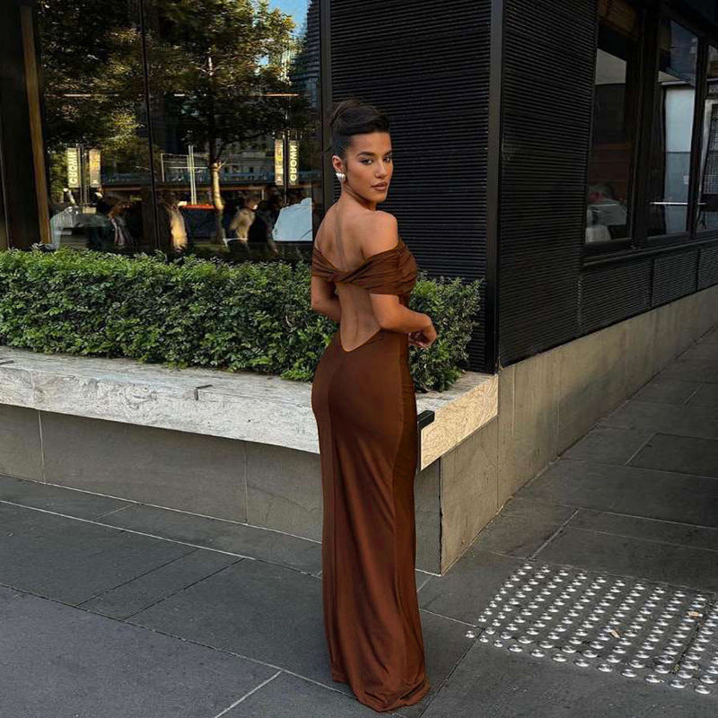 Form-fitting, long off-the-shoulder dress with an open back.