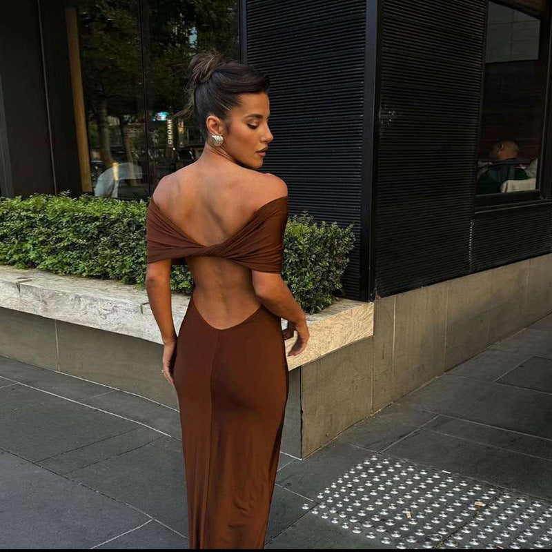 Form-fitting, long off-the-shoulder dress with an open back.